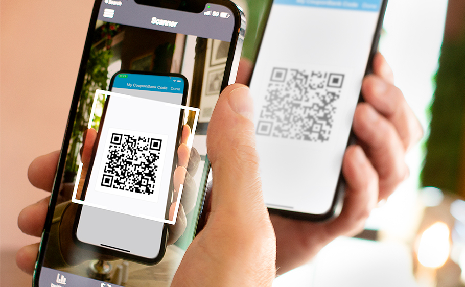 A customer’s CouponBank QR code being scanned for redemption